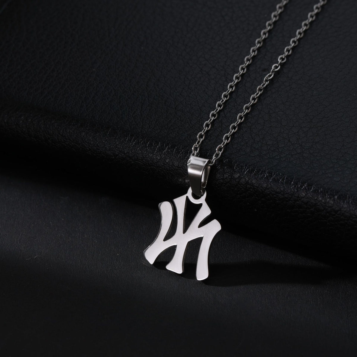 Silver stainless steel necklace with a Yankees NY logo pendant on a cable chain.
