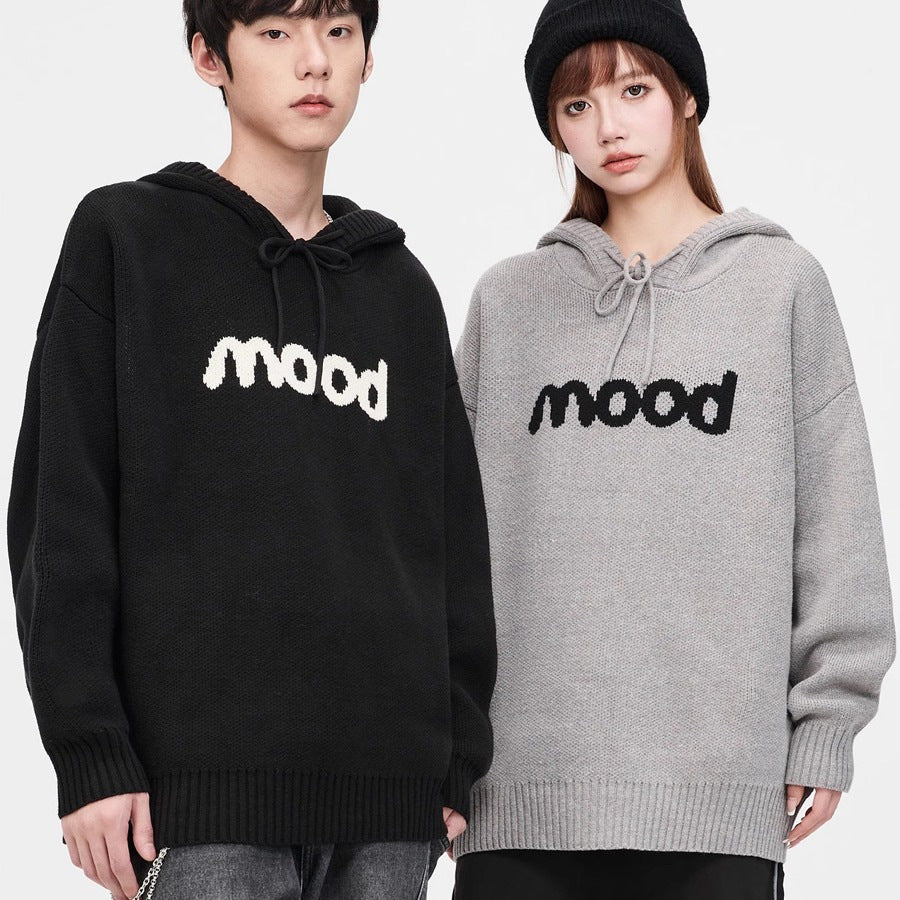 Two models wearing black and grey knit hoodies with "mood" text, ribbed hems, and drawstrings.