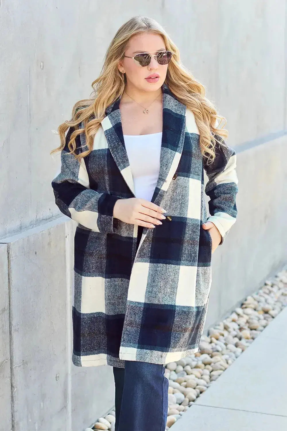 Women's plaid button-up lapel coat by Plush Fashion Hub, seasonal wool-feel outerwear with classic plaid pattern and tailored fit.