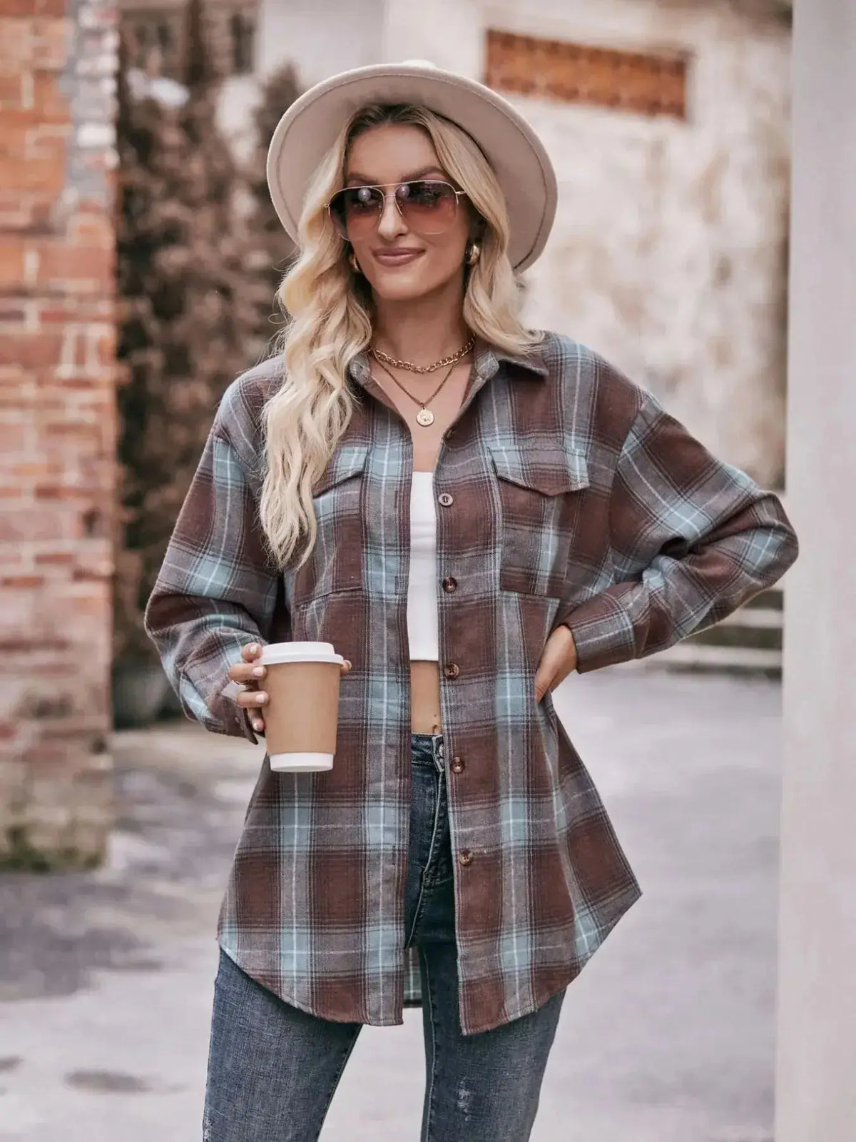 Plaid long sleeve button-down shirt for women, by Plush Fashion Hub, featuring classic plaid pattern and tailored fit.