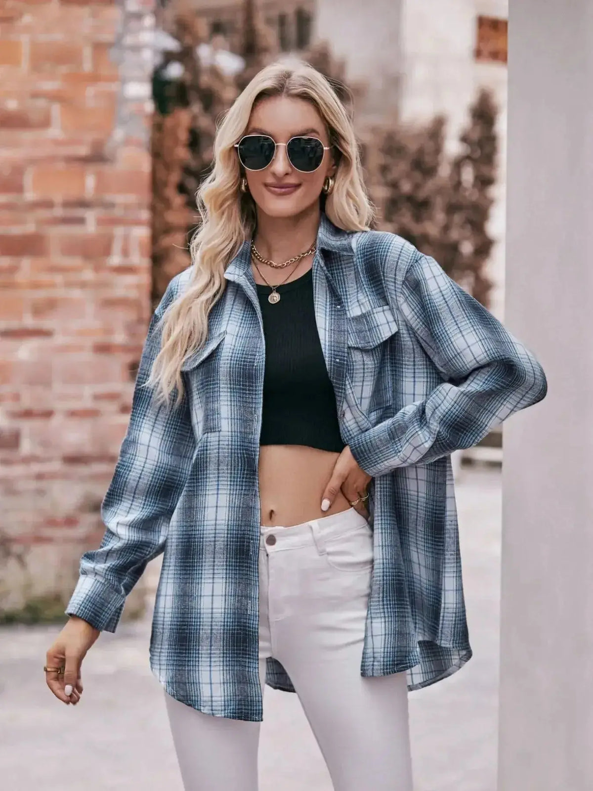 Plaid long sleeve button-down shirt for women by Plush Fashion Hub, featuring classic plaid pattern and tailored fit.