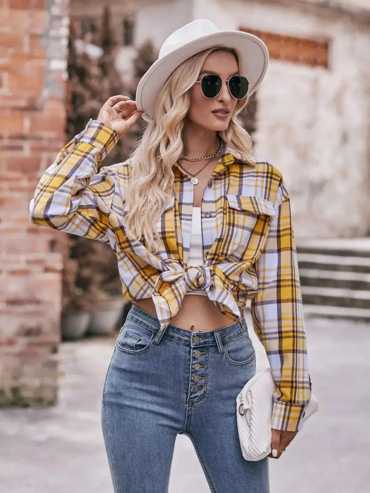 Women's classic plaid long sleeve button-down shirt by Plush Fashion Hub, featuring a timeless checkered design and casual fit.