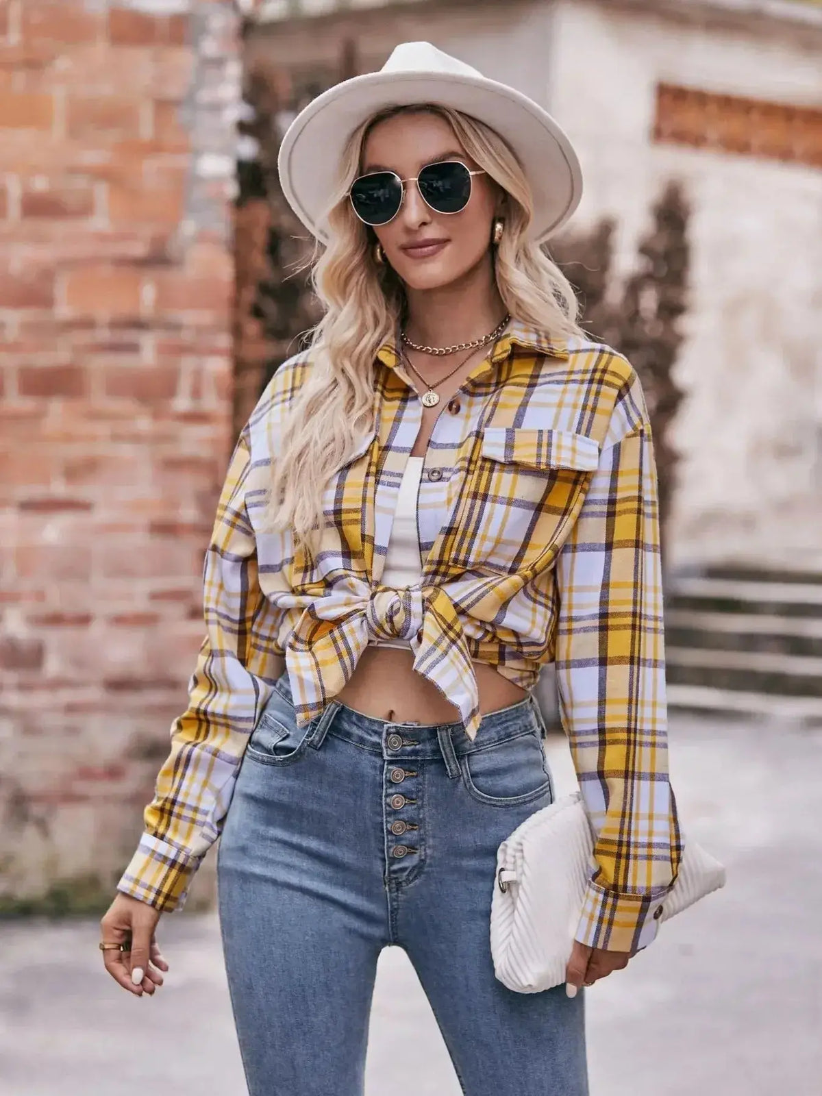 Women’s classic plaid long sleeve button-down shirt by Plush Fashion Hub, featuring a stylish plaid pattern and tailored fit.