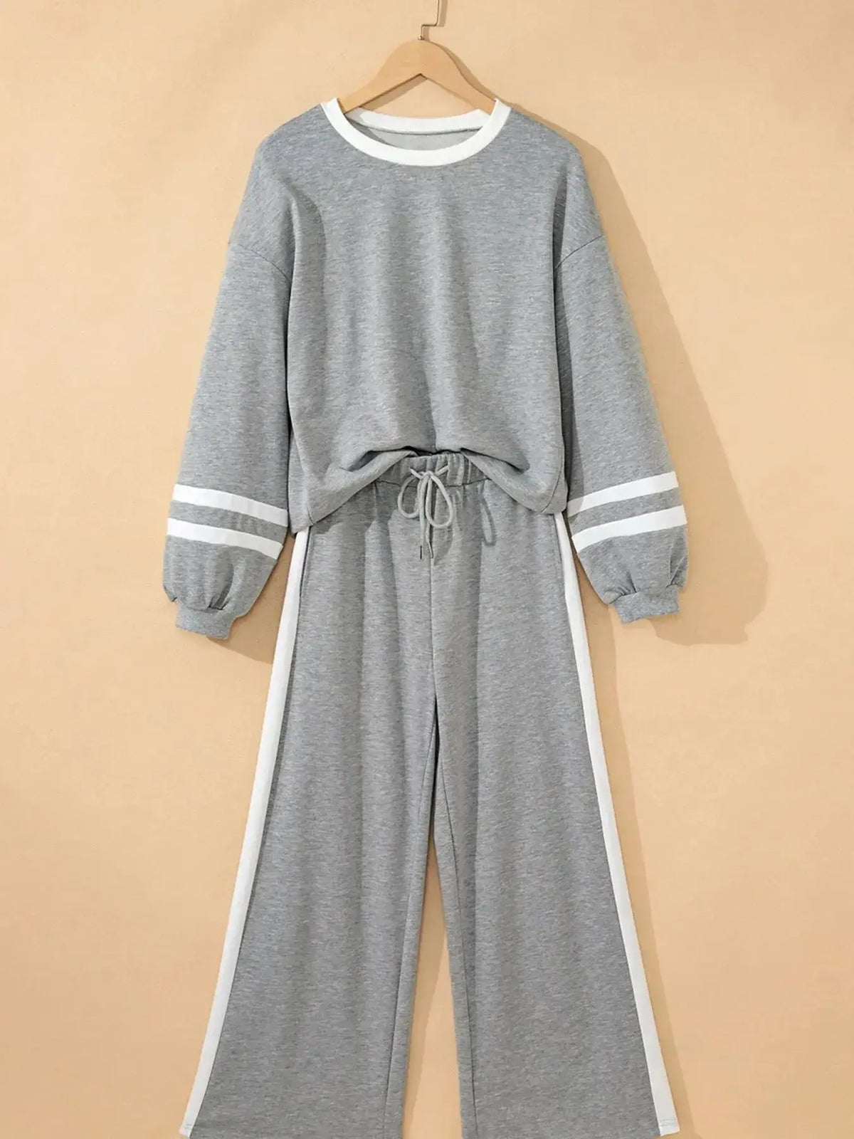 Plush Fashion Hub cozy two-piece lounge set with contrast trim, featuring a round neck top and matching pants for comfortable casual wear.
