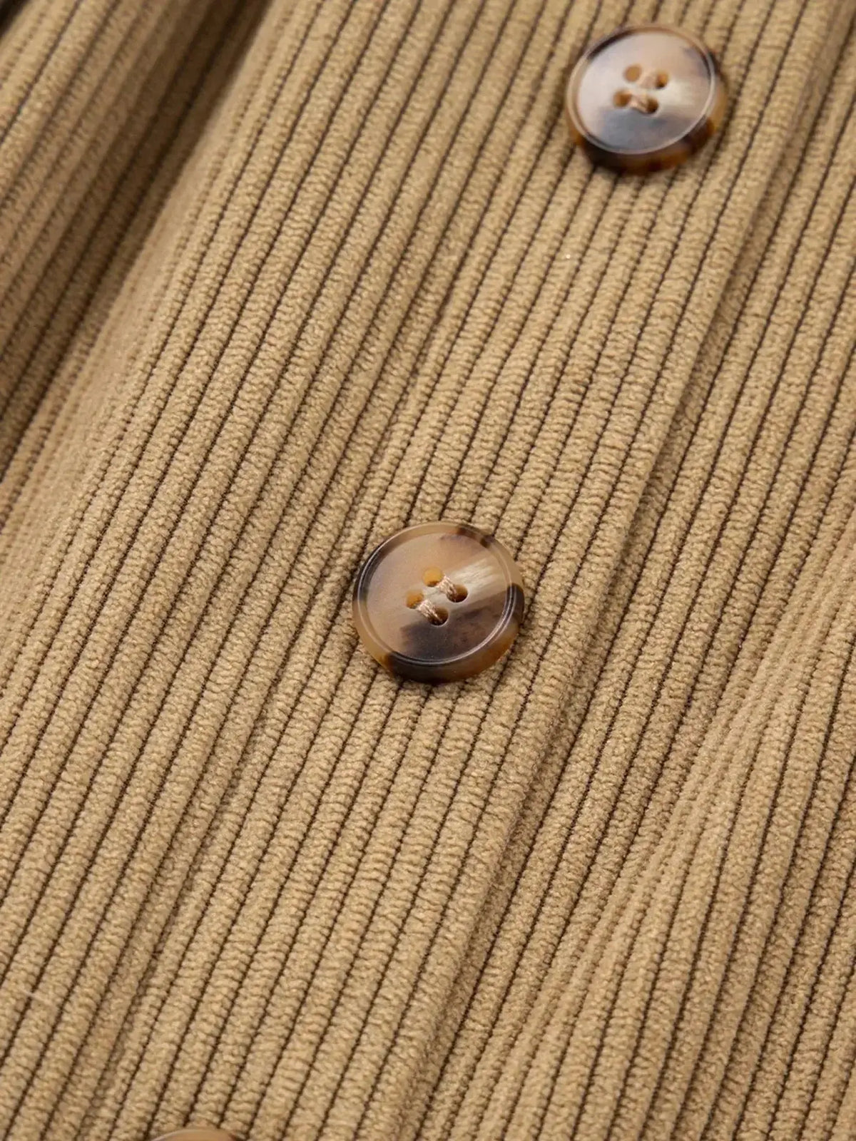 Women’s high-waisted corduroy mini skirt with button-front closure, in a plush fashion style, shown in beige fabric.