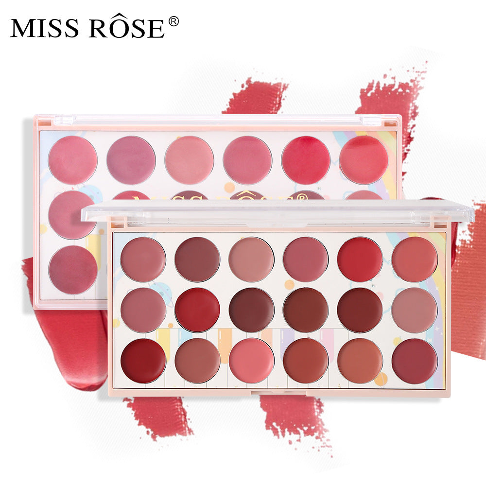 Two rectangular plastic makeup palettes with 18 circular pans of pink and red lip shades against a pastel patterned background