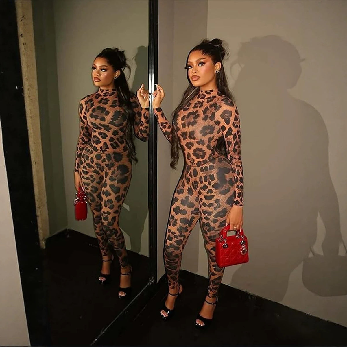 Serpentine print long sleeve fitted jumpsuit by eprolo featuring a matching top and pants set with a sleek, form-fitting design.