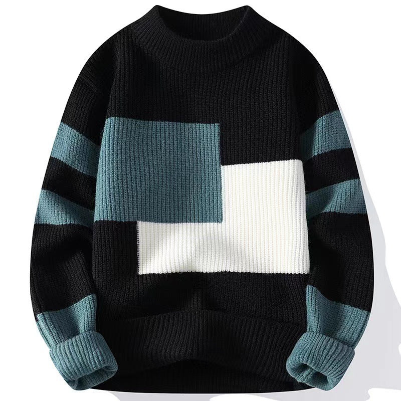 Black knit sweater with ribbed crewneck, teal and white colorblock front, and striped sleeves.
