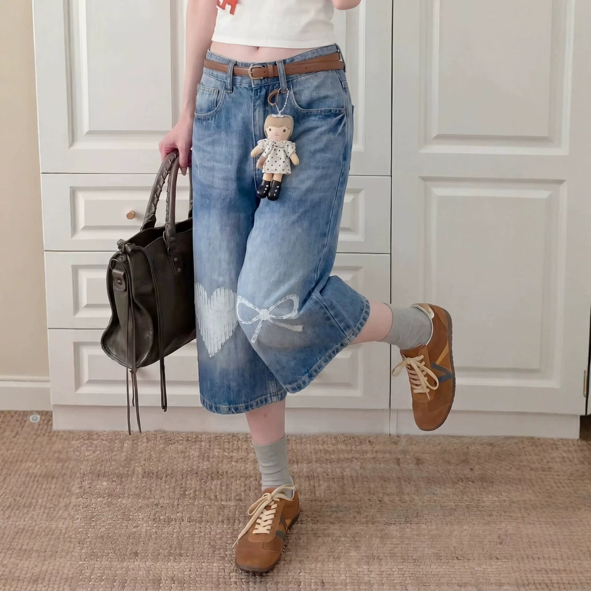 Washed bleached wide-leg straight jeans by Plush Fashion Hub displayed on a model, showcasing the relaxed fit and stylish denim.