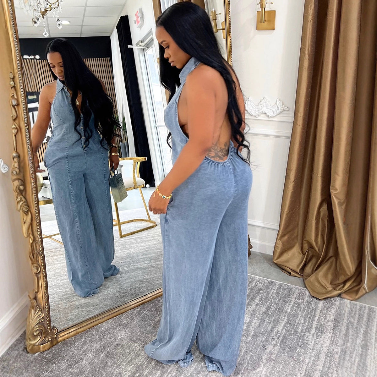 Women's denim jumpsuit by eprolo featuring a turn-down collar, halter neckline, and single button closure, perfect for autumn winter fashion.