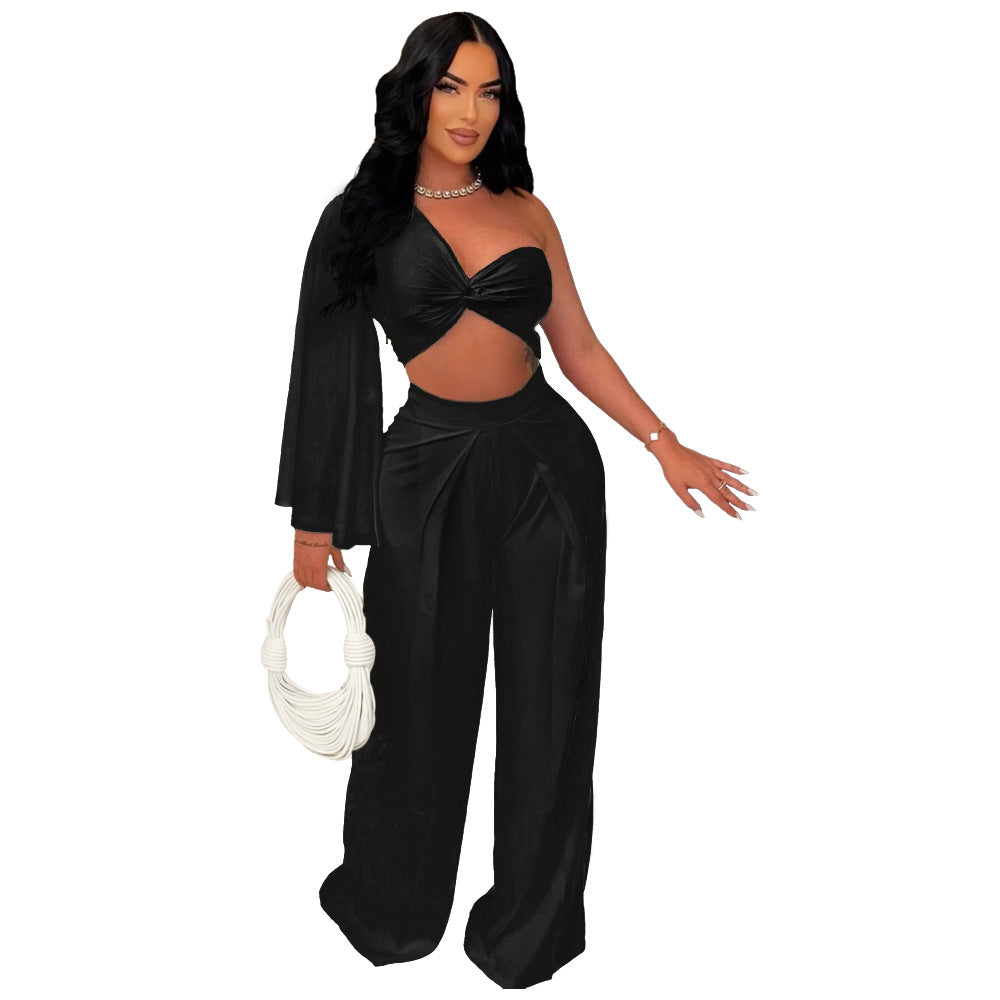 Asymmetrical pleated one-shoulder top and matching trousers set by Plush Fashion Hub, stylish and modern women's outfit.