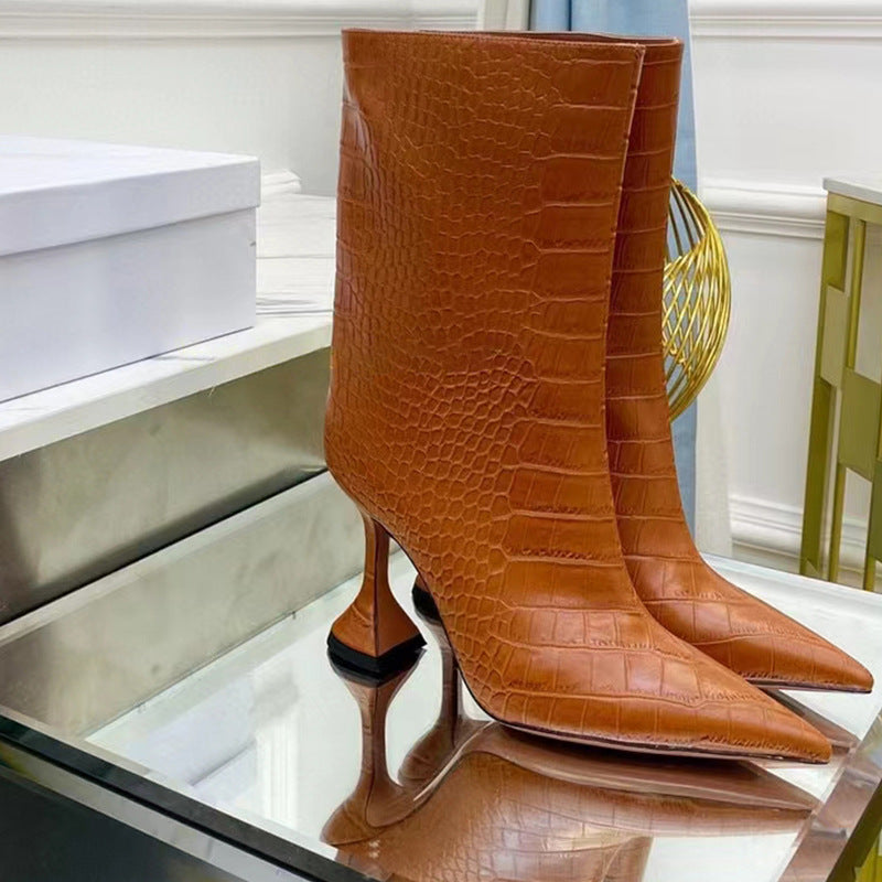 Brown faux leather mid-calf boots with crocodile pattern, pointed toe, and flared stiletto heels.