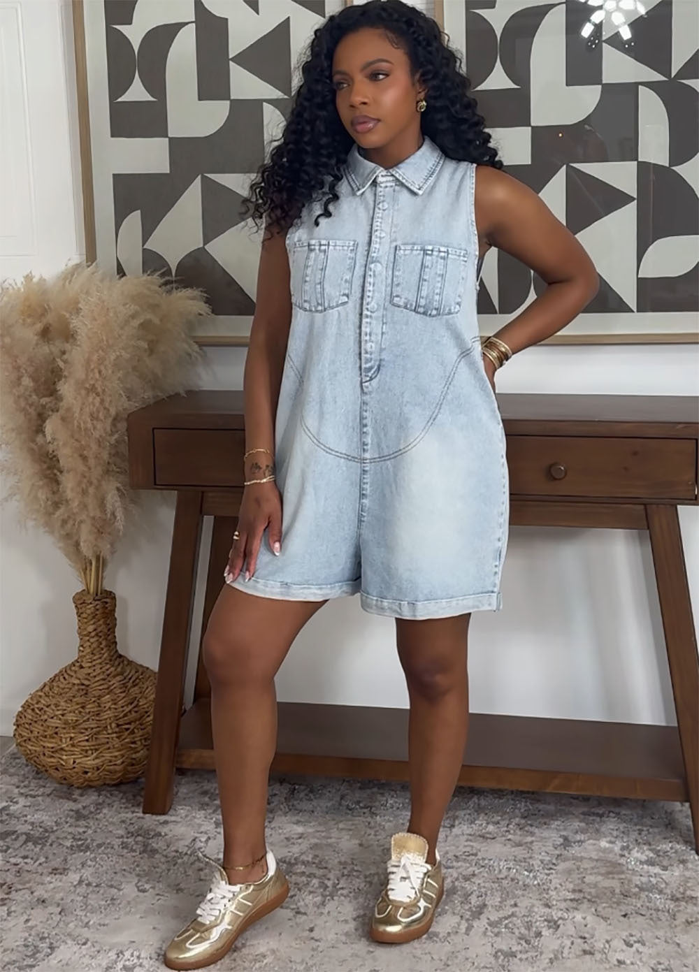 Fashionable sleeveless denim jumpsuit with turn-down collar for women, featuring a loose fit and stylish design by eprolo.