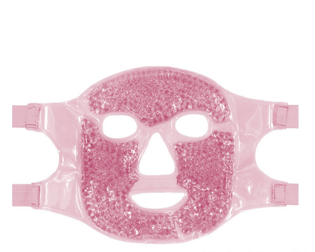 Pink gel bead facial mask in a glossy plastic finish with cutouts for eyes, nose, and mouth, plus side straps.