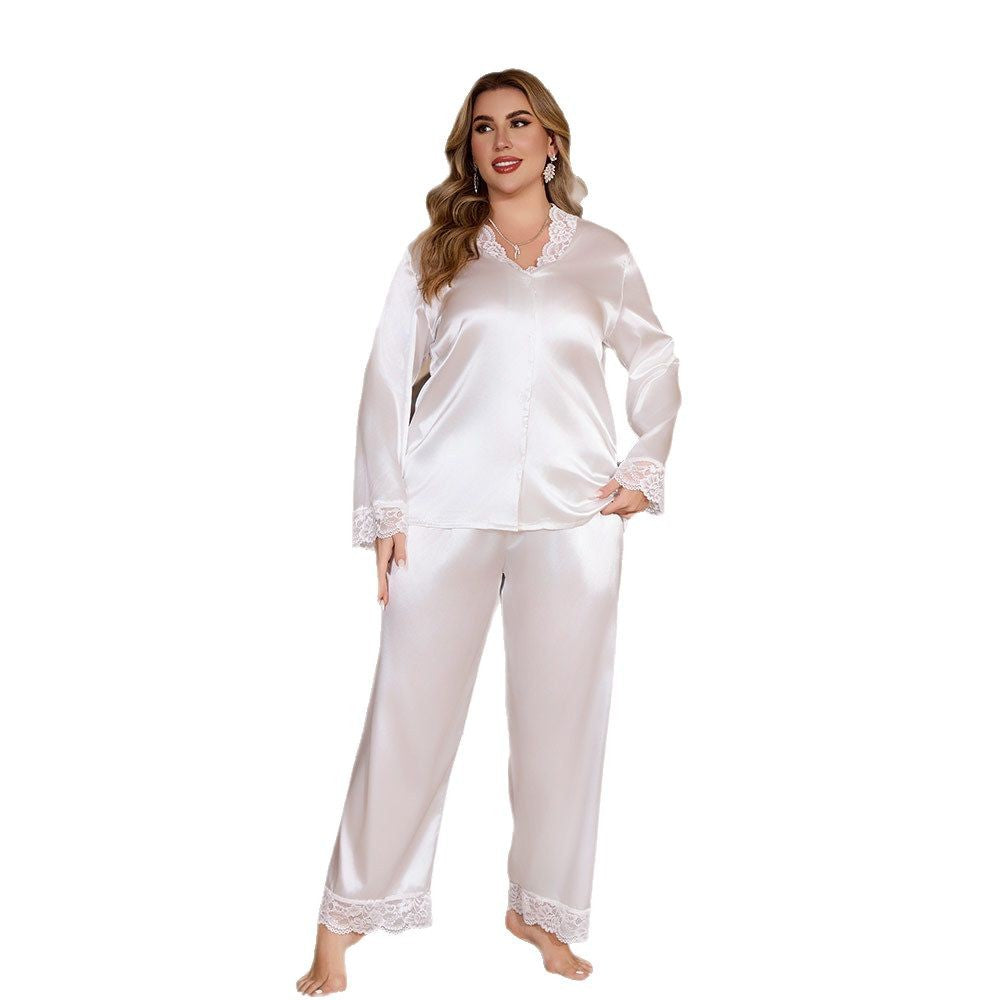 White satin pajama set with long sleeves, V-neck, and white lace trim on collar, cuffs, and pant hems.