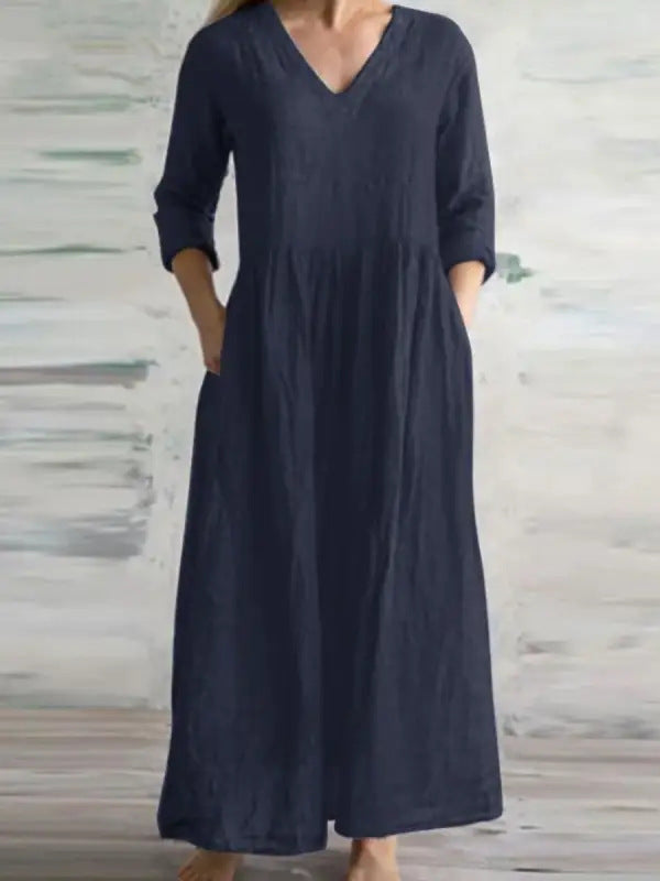 Light beige eprolo V-neck loose fitting long skirt with flowing fabric and relaxed fit, perfect for casual wear.