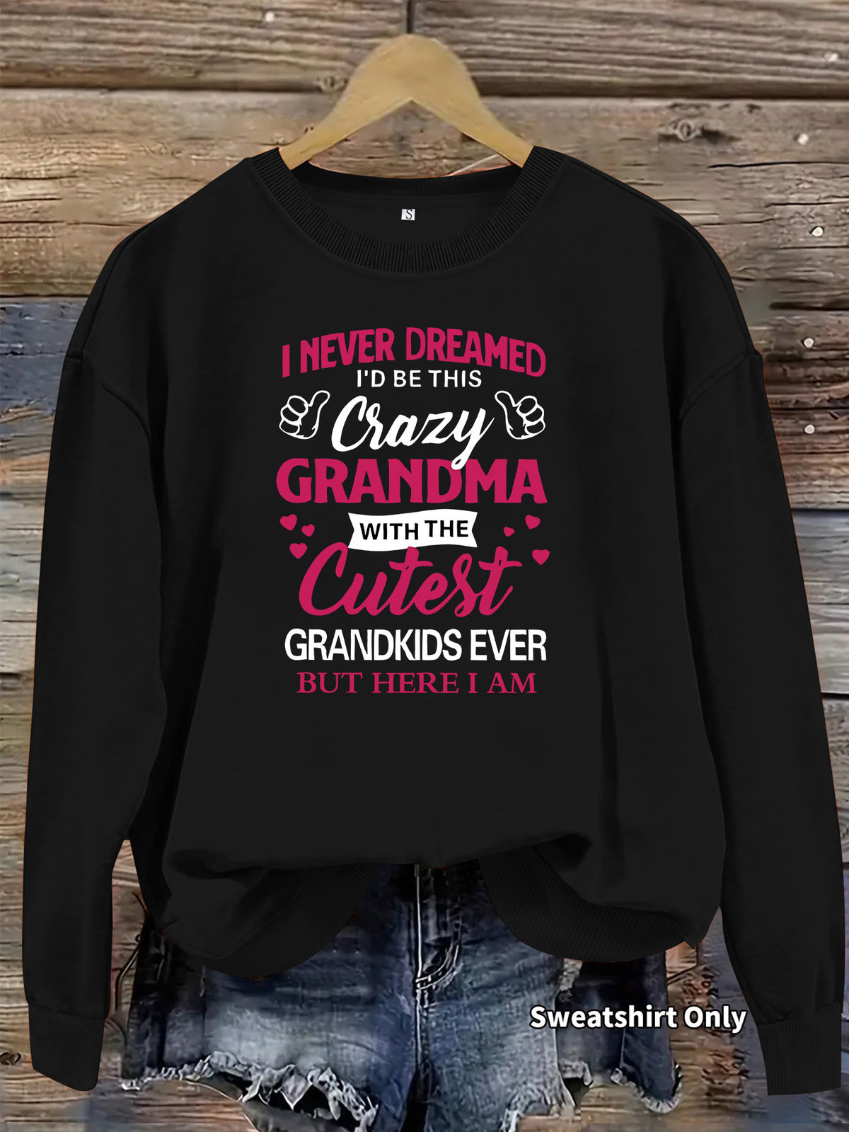 Black crewneck sweatshirt featuring white and pink text: "I NEVER DREAMED... CRAZY GRANDMA".