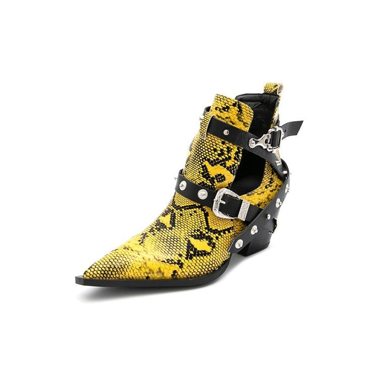 Yellow and black snakeskin ankle boot with pointed toe, black leather straps, silver buckles, and studs.