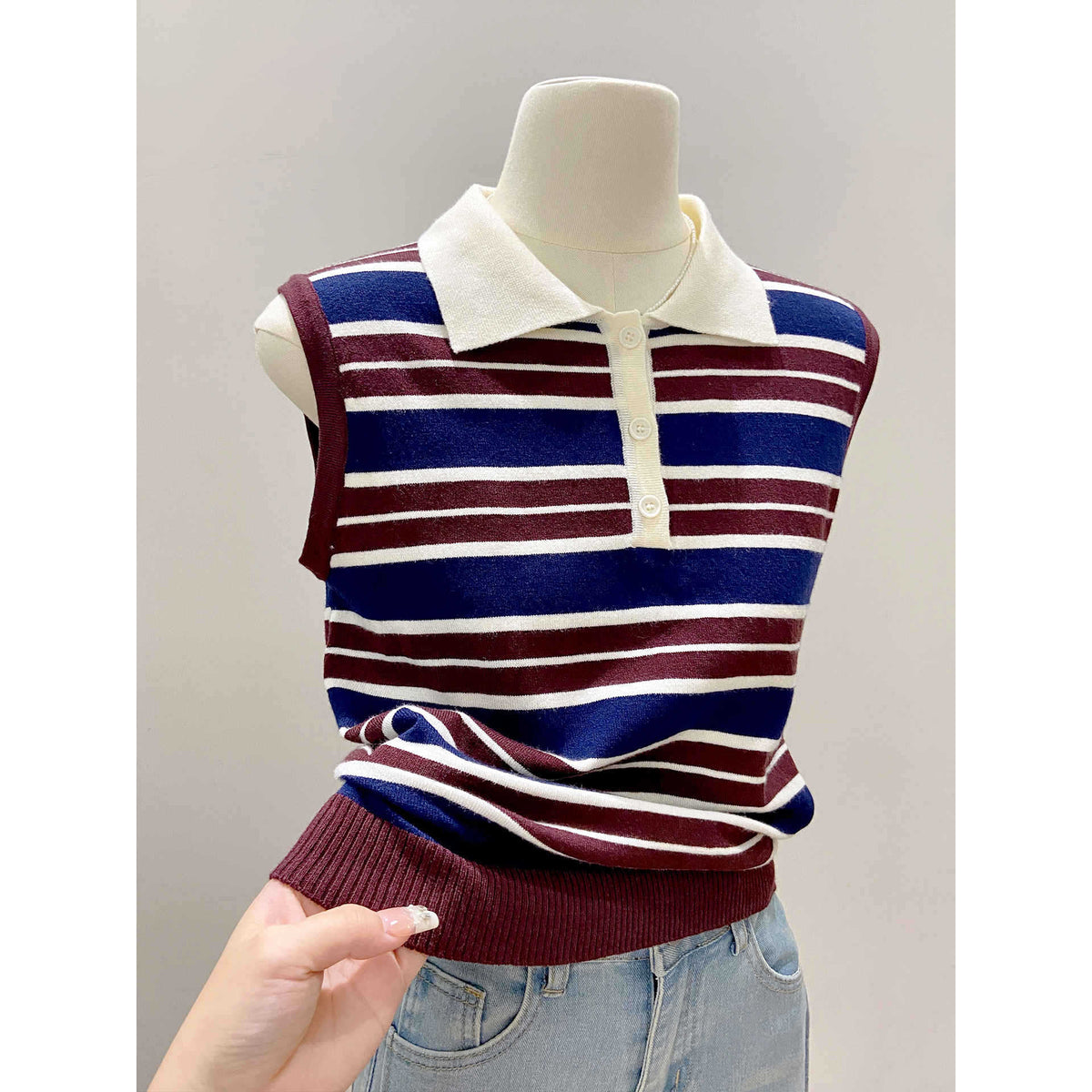 Color-blocked stripe knit vest for women by eprolo, featuring bold multicolor panels and a cozy knit texture.