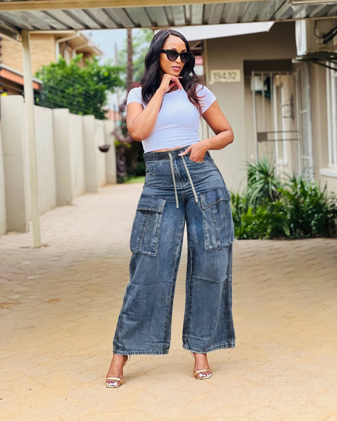 Wide-leg cargo jeans by Plush Fashion Hub featuring street style design with multiple pockets and relaxed fit.