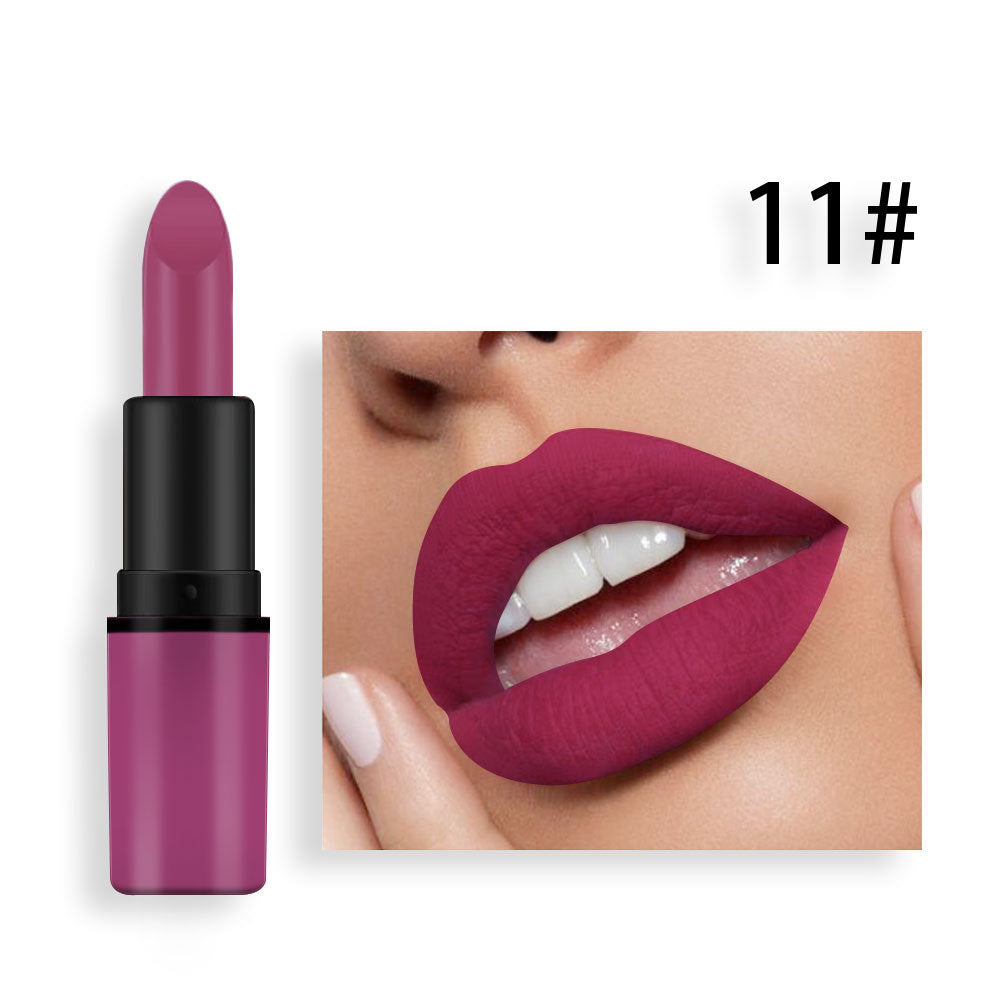 Matte mauve-pink lipstick in a black and pink tube, shown with matching lipstick on lips.