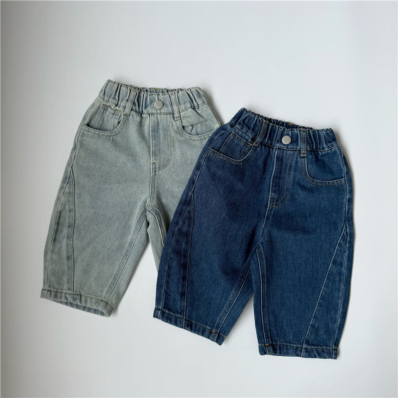 Two pairs of light blue and dark blue denim kids pants with elastic waistbands, pockets, and seamed legs.