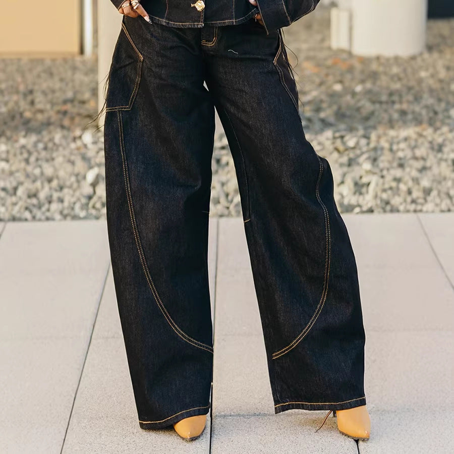Dark blue curved hem stitched denim jeans from Plush Fashion Hub featuring classic five-pocket design and tapered fit.