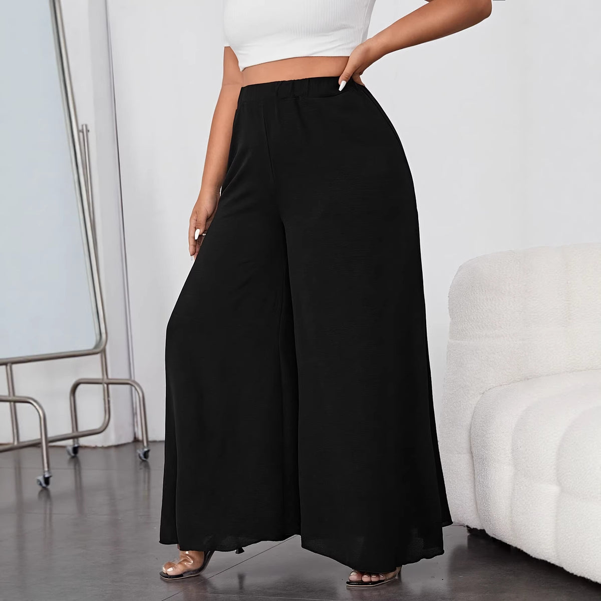 Solid black high-waist palazzo trousers with a smooth, lightweight fabric and wide, flowing legs.