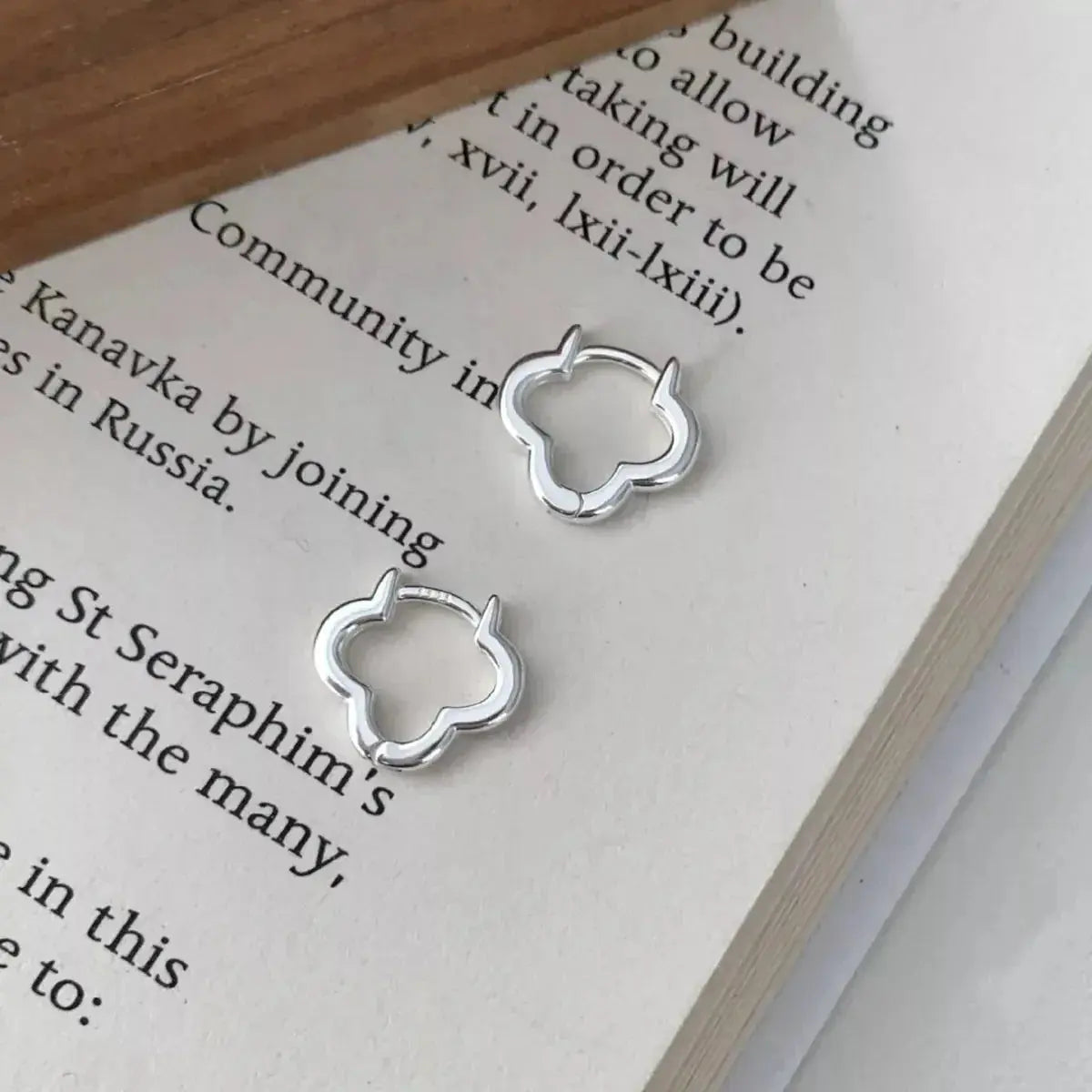 925 sterling silver four-leaf clover stud earrings, Lucky jewelry accessory with detailed clover design for women.