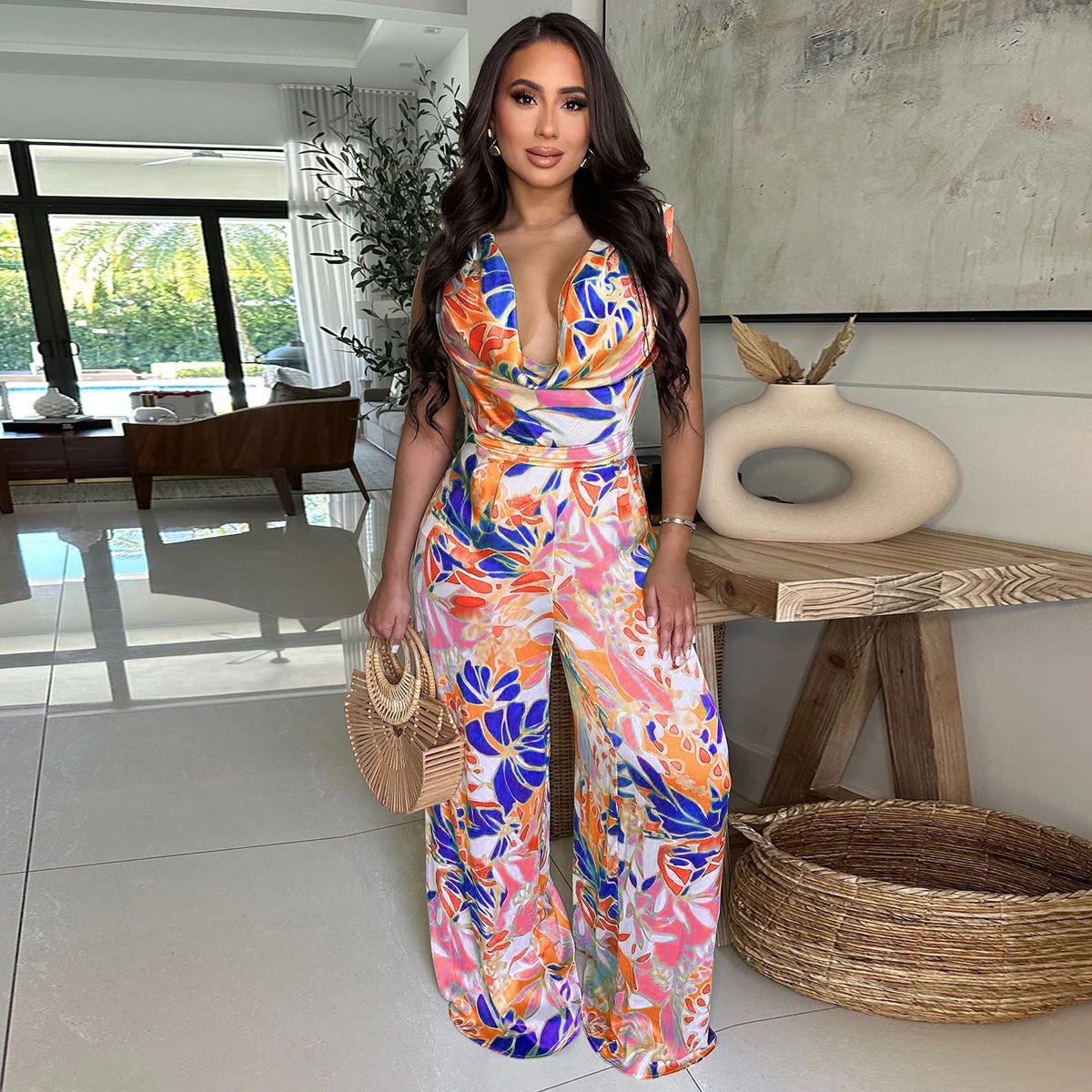Women’s sleeveless printed jumpsuit with lace-up detail and wide-leg design from Plush Fashion Hub.