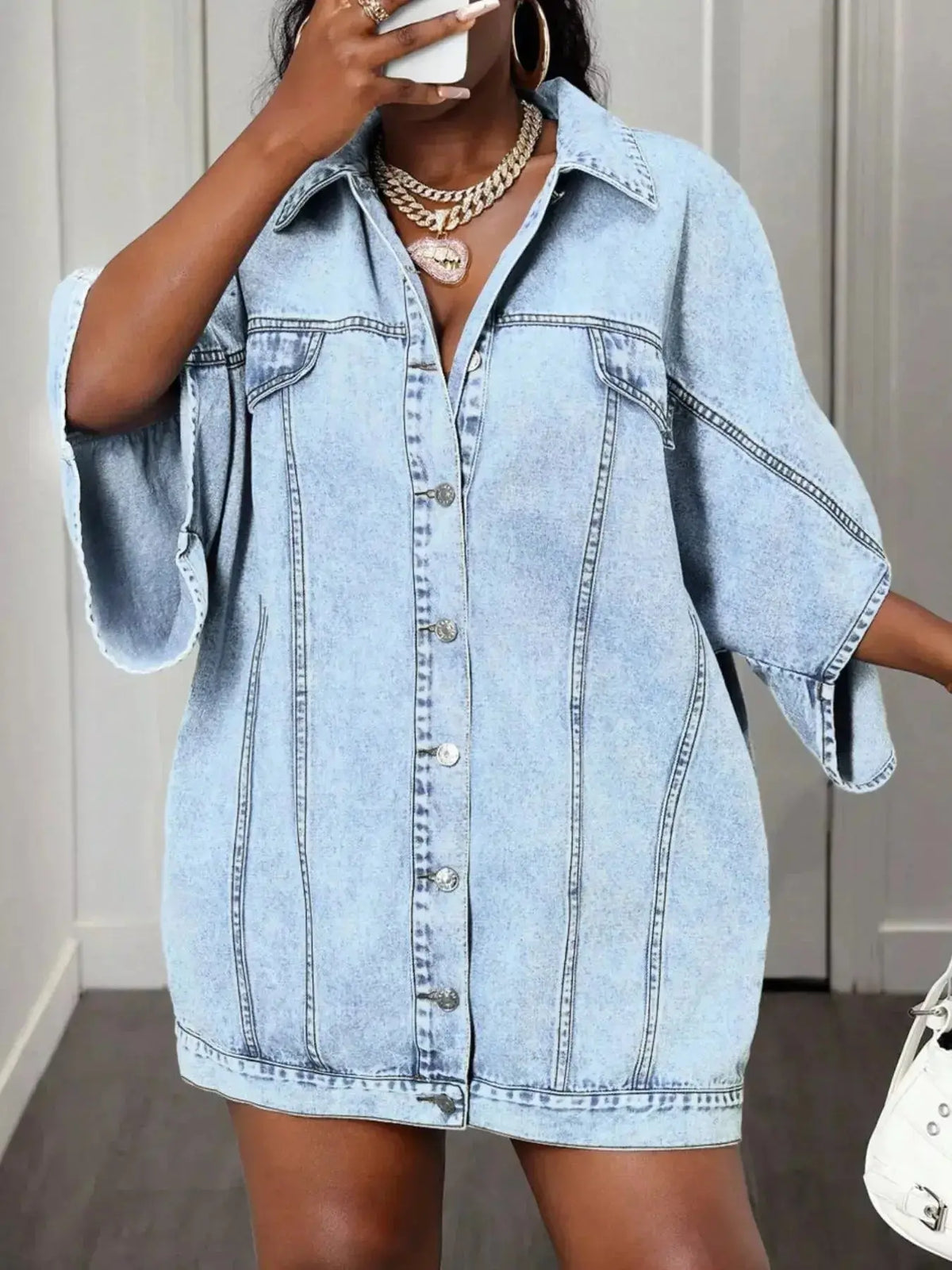 Women's oversized denim button-down shirt with batwing sleeves from Plush Fashion Hub, casual and trendy for everyday wear.