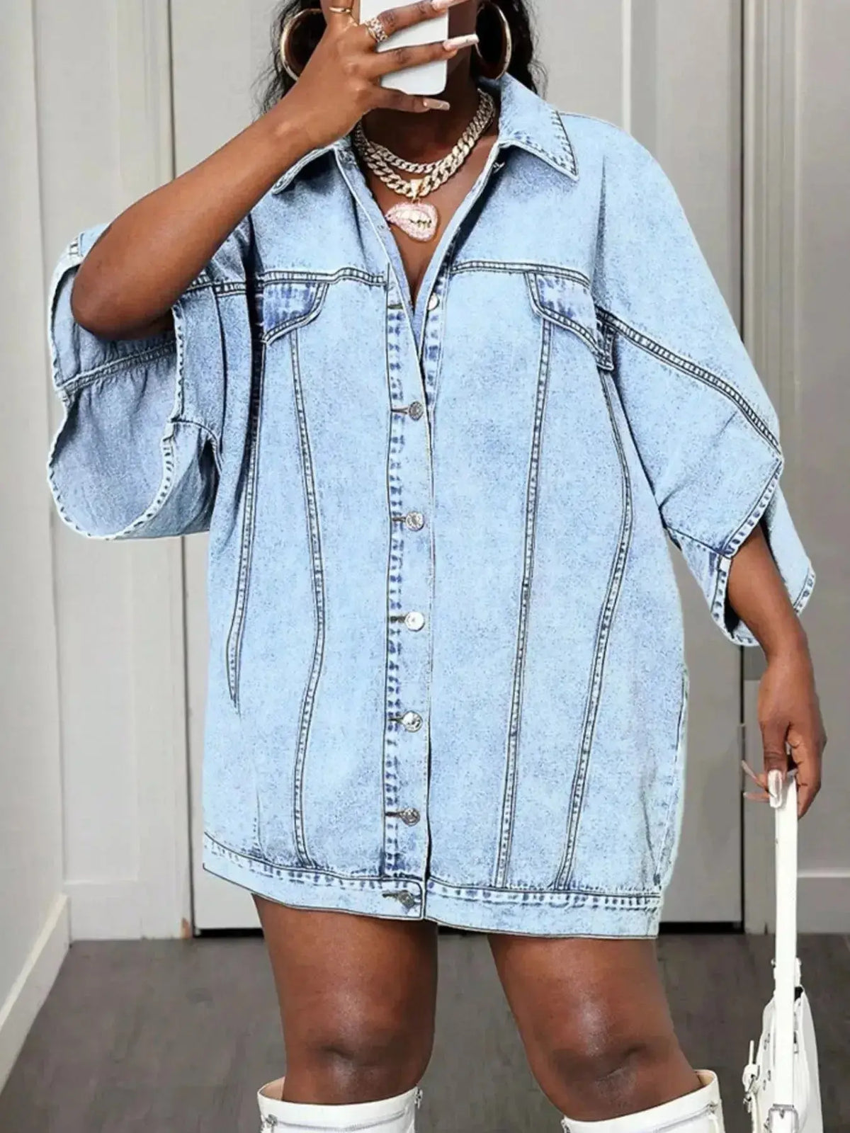 Women's oversized denim button-down shirt with batwing sleeves by Plush Fashion Hub, casual and trendy for everyday wear.