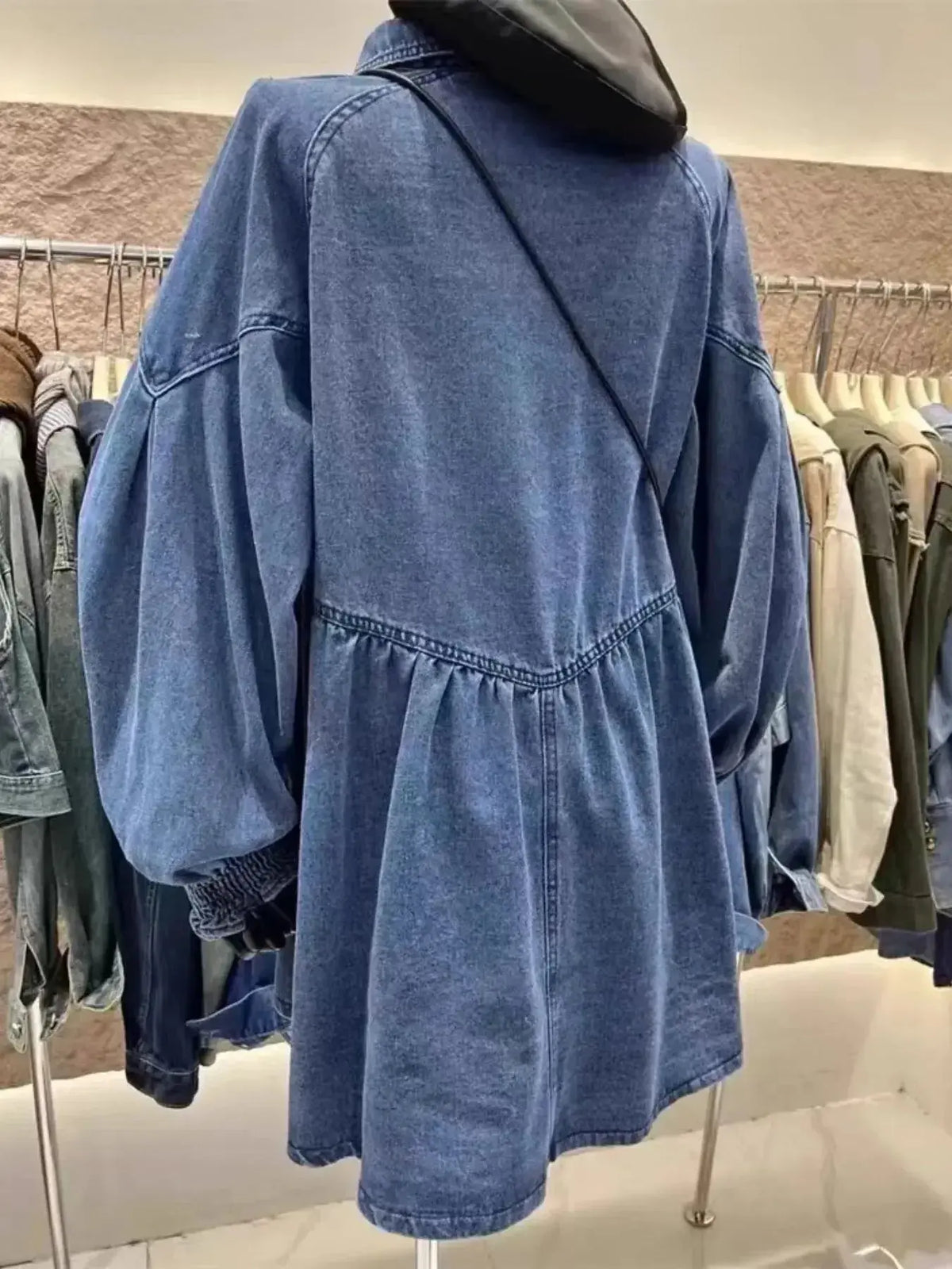 Oversized long sleeve button-up denim dress by Plush Fashion Hub, shown in a casual fit with front buttons and classic denim fabric.