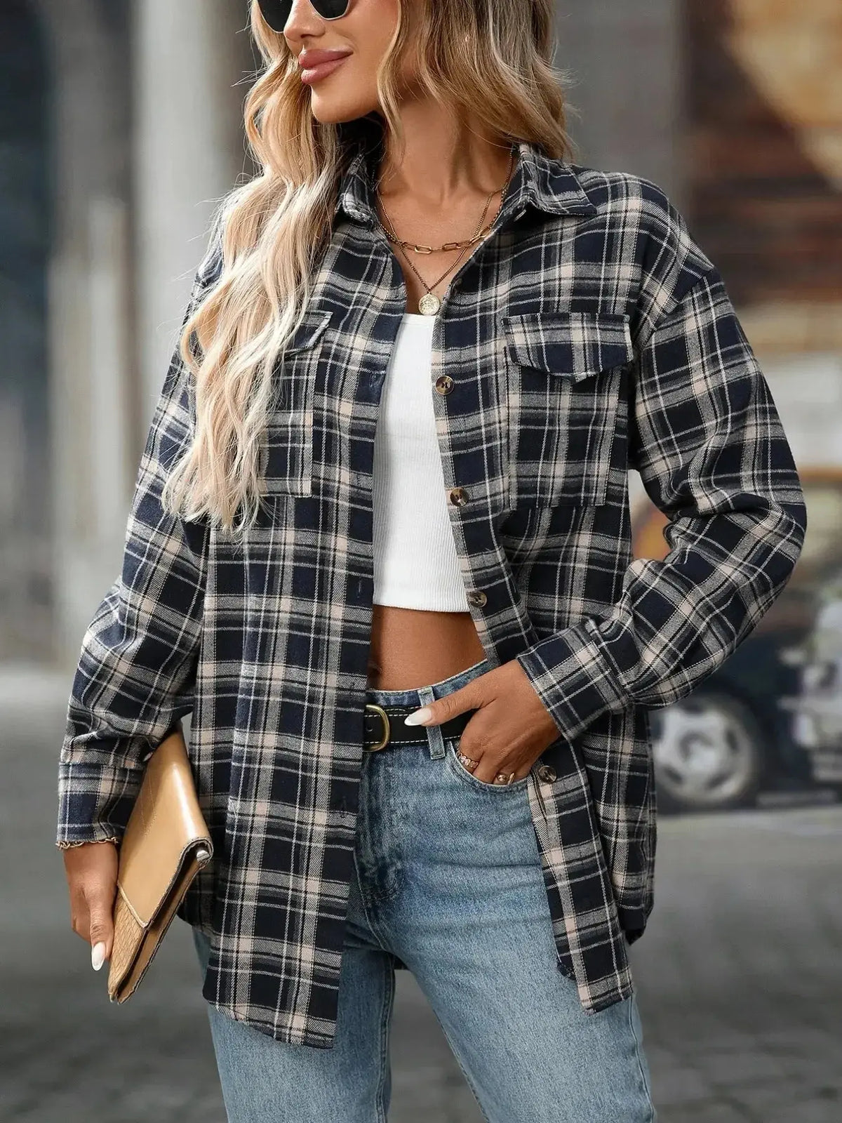 Oversized plaid flannel button-down shirt for women by Plush Fashion Hub, featuring a soft, casual design and classic checkered pattern.