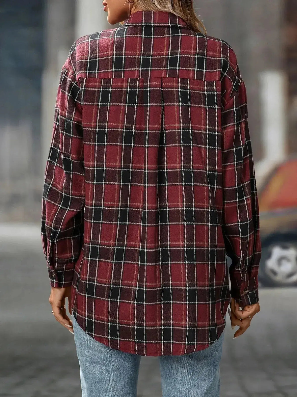 Women's oversized plaid flannel button-down shirt by Plush Fashion Hub, soft casual flannel top with a relaxed fit and classic pattern.