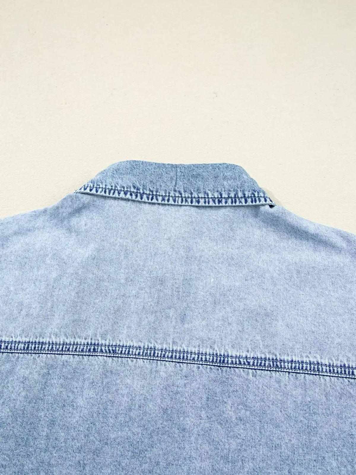 Relaxed cotton denim button-down shirt dress with pockets and raw hem, stylish and casual by Plush Fashion Hub.