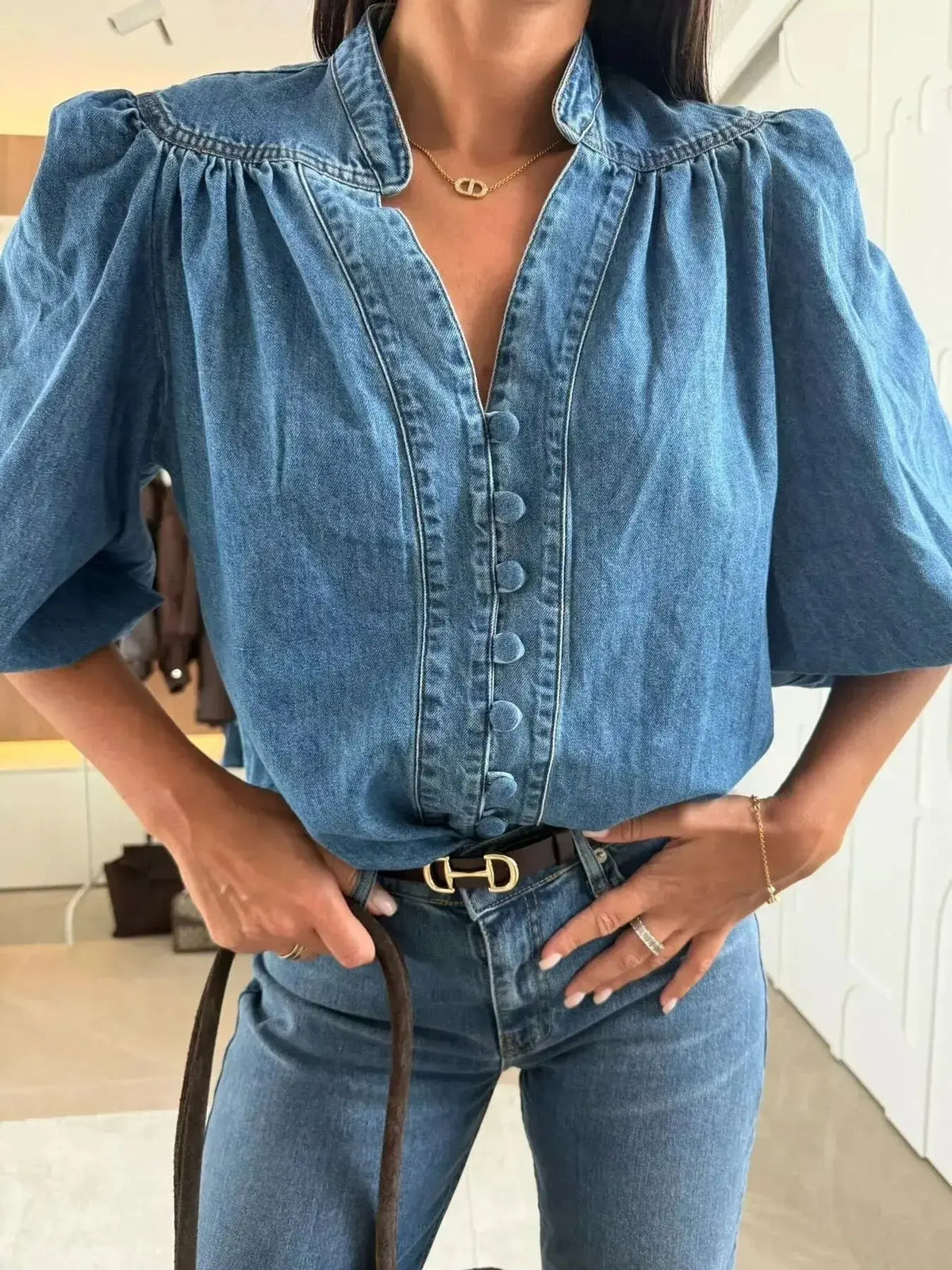 Women’s blue denim button-down blouse with puff sleeves, structured casual chic style by Plush Fashion Hub.