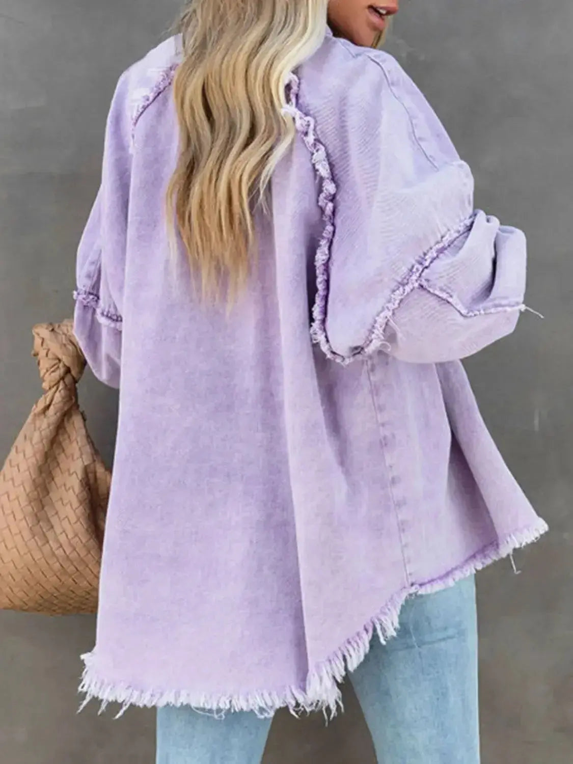 Women’s cotton blend denim jacket with button-down front and raw hem, casual outerwear by Plush Fashion Hub.
