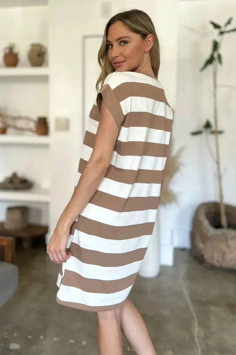 Women’s casual striped mini dress with round neck and cap sleeves by Plush Fashion Hub, shown in a relaxed fit.