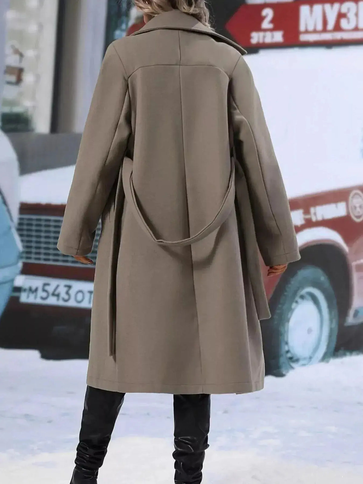 Women’s double-breasted trench coat with tie waist belt by Plush Fashion Hub, shown on a model with classic style and neutral color.