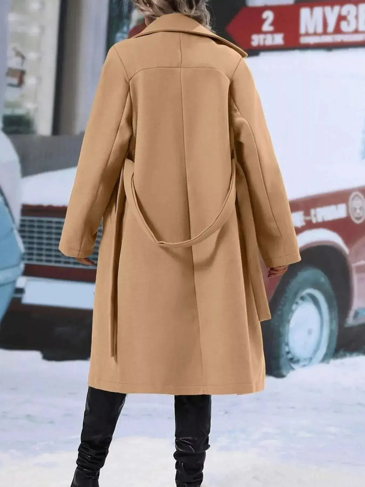 Women’s double-breasted trench coat by Plush Fashion Hub featuring a tie waist belt and classic design in neutral fabric.