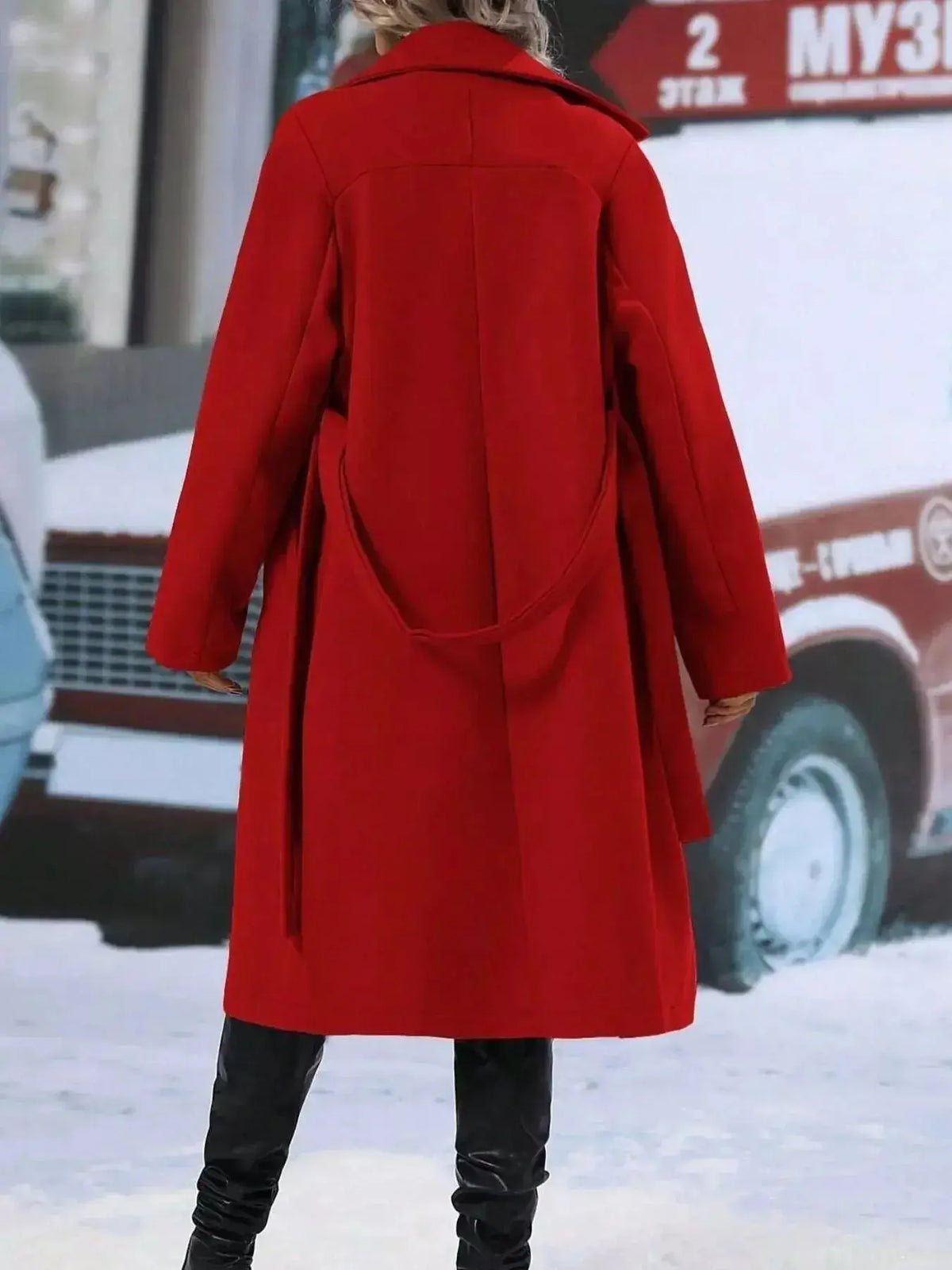 Women’s double-breasted trench coat with tie waist belt, stylish outerwear by Plush Fashion Hub, shown on a model.