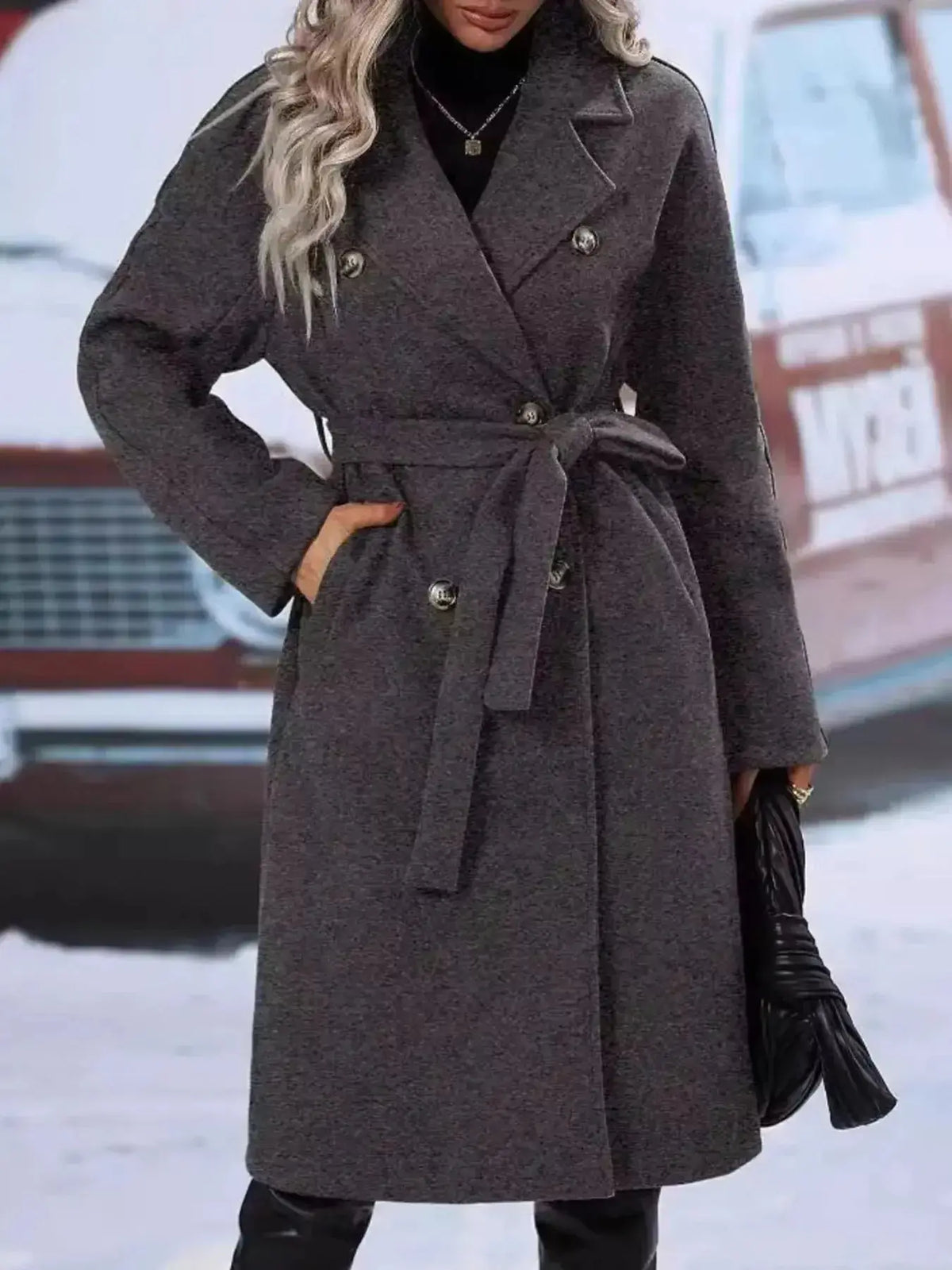 Women's double-breasted trench coat by Plush Fashion Hub with tie waist belt, shown hanging with classic collar and button details.
