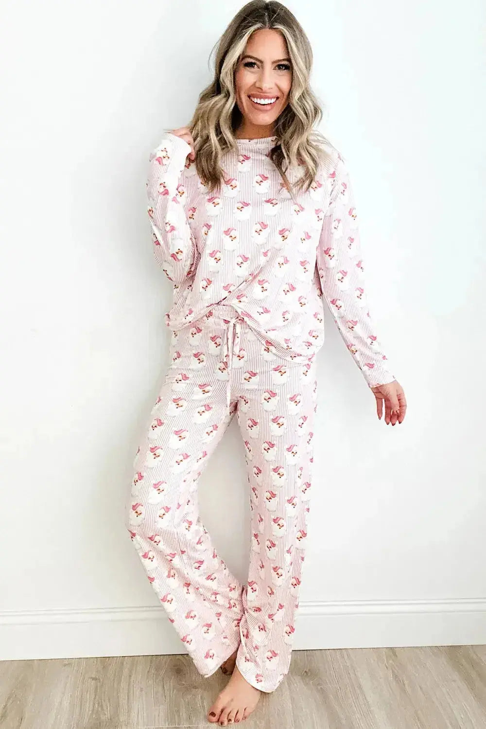 Women’s festive Santa print long sleeve pajama lounge set by Plush Fashion Hub, featuring cozy holiday-themed pajamas.