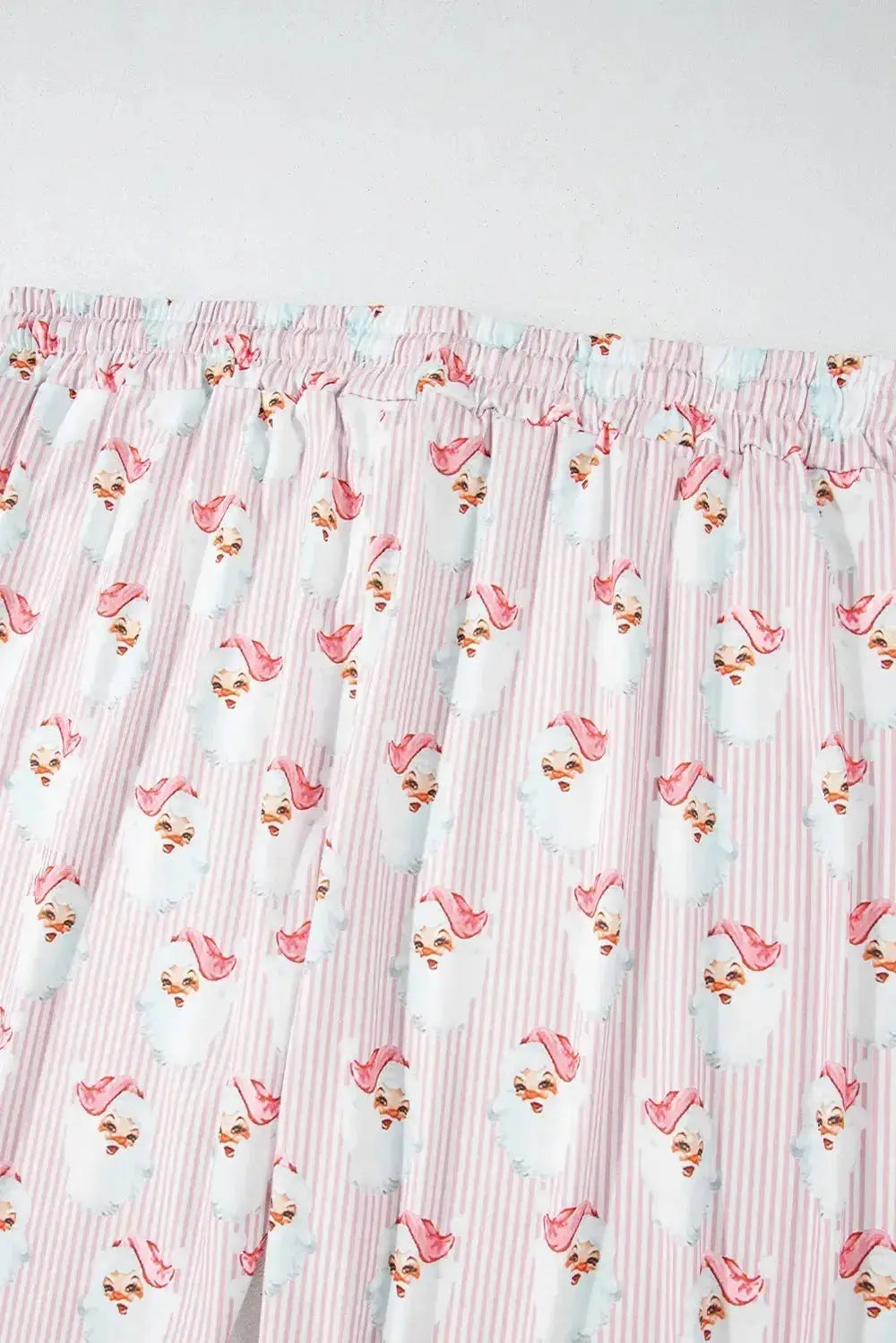 Women’s festive Santa print long sleeve pajamas lounge set by Plush Fashion Hub, featuring a cozy holiday-themed design.