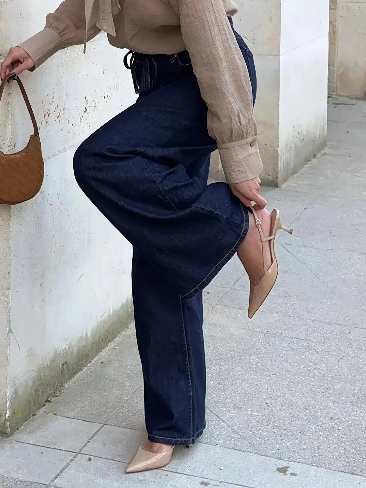 Women’s high-waisted tied loose fit flare jeans by Plush Fashion Hub, relaxed denim with a stylish flare and comfortable fit.