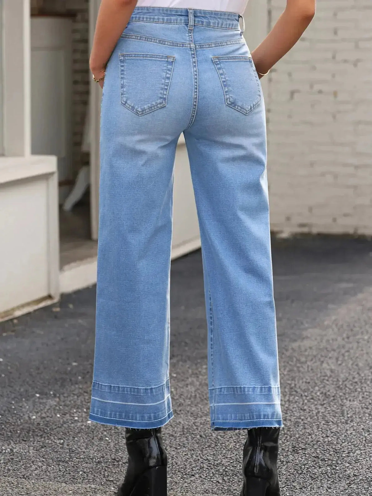 Women’s high-waisted wide-leg washed denim jeans by Plush Fashion Hub, relaxed fit style shown on model.