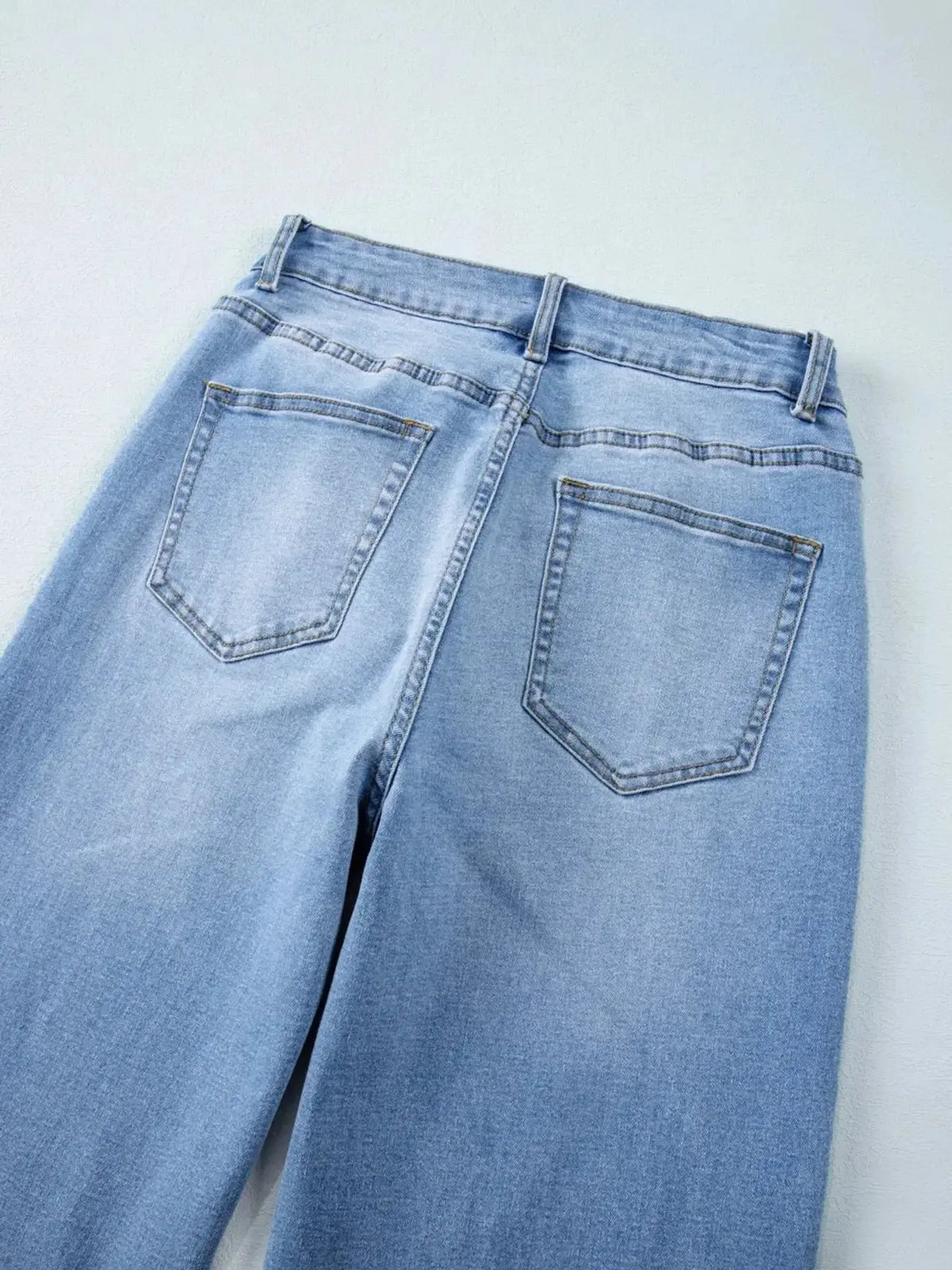 Women’s high-waisted wide-leg washed denim jeans by Plush Fashion Hub, featuring a classic relaxed fit and trendy style.