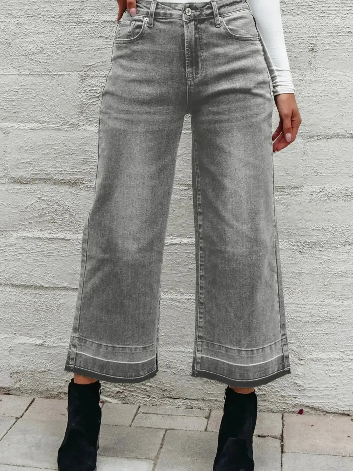 Women’s high-waisted wide-leg washed denim jeans with a relaxed fit, from Plush Fashion Hub, shown on a model.