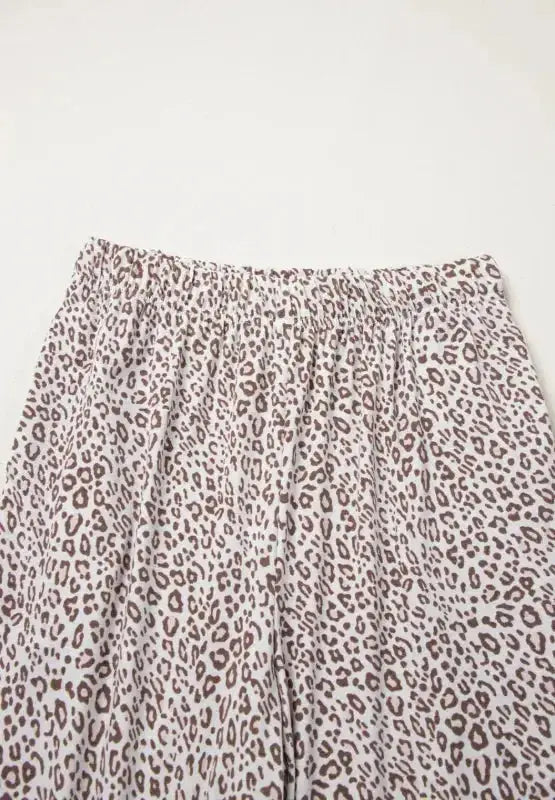 Women's leopard print long sleeve button-down pajama lounge set by Plush Fashion Hub, featuring a stylish and comfortable sleepwear design.